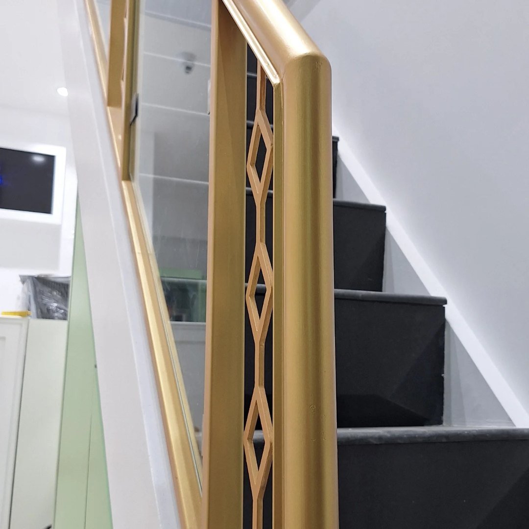 Staircase With Brass Railing